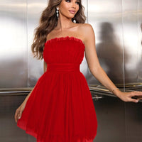 Women's tube top mesh dress with bow detail and pettiskirt style by MANDOTOS, featuring a graceful, stylish design.