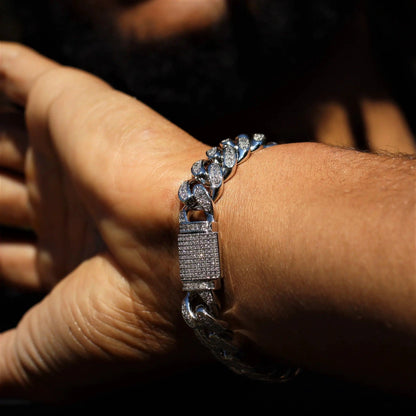 12mm white gold diamond Cuban link bracelet by MANDOTOS, featuring a sleek, polished design with sparkling diamonds.