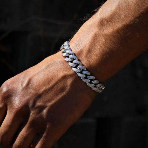 12mm white gold diamond Cuban link bracelet by Mandotos, showcasing a luxurious, polished jewelry piece with sparkling diamonds.