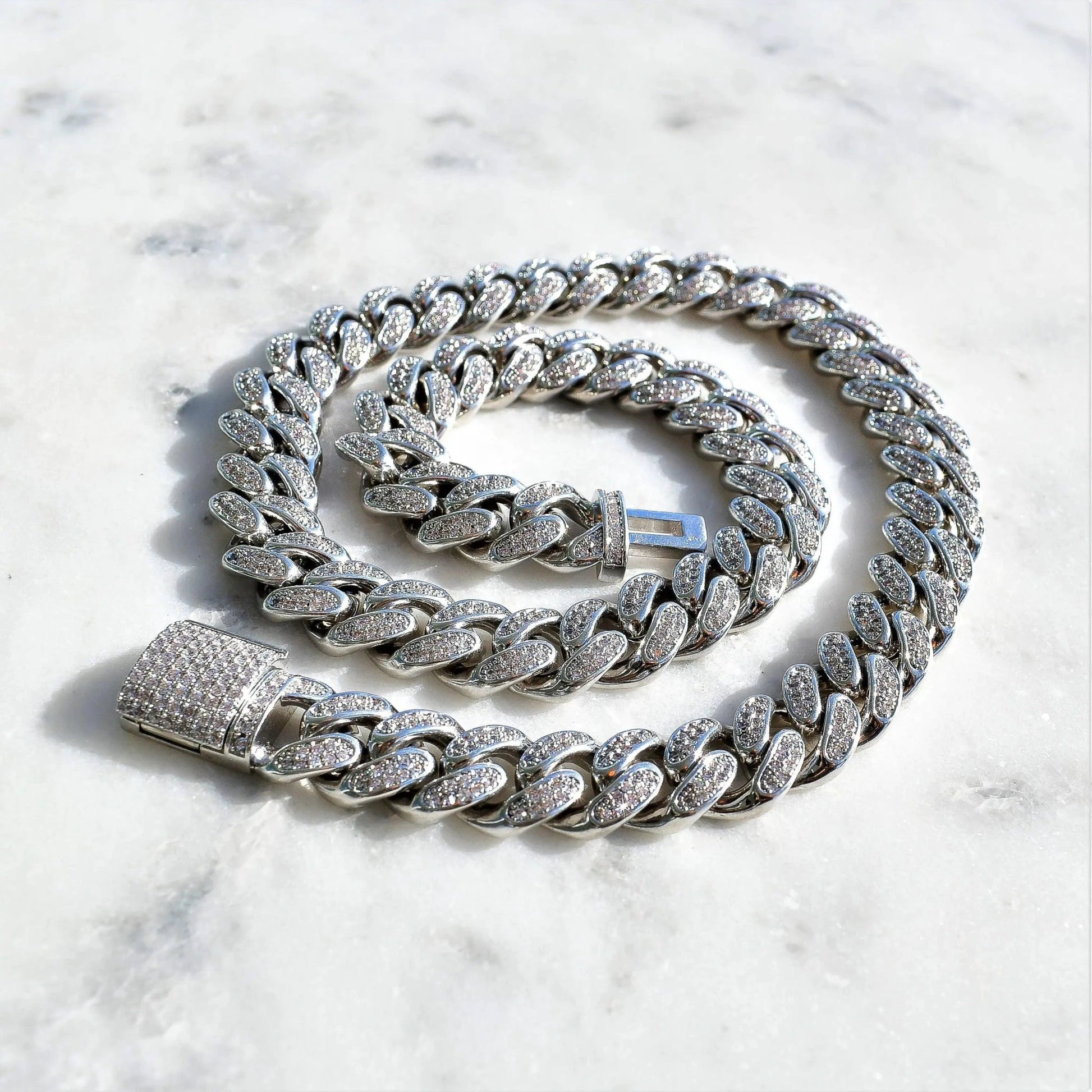 12mm white gold diamond Cuban link bracelet by Mandotos featuring sparkling diamonds and a bold, luxurious design.