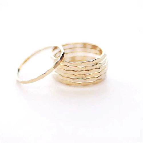 14K gold-filled textured stacking ring from MANDOTOS, showcasing a detailed hammered finish on a slim band.