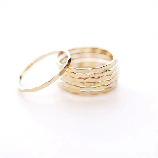 14K gold-filled textured stacking ring from MANDOTOS, showcasing a detailed hammered finish on a slim band.