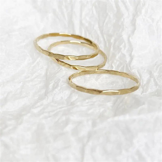 14K gold-filled textured stacking ring by MANDOTOS, showcasing a detailed, shiny band ideal for layered jewelry styles.