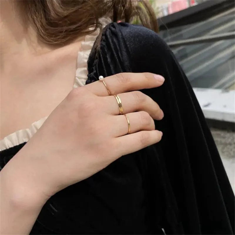 14K gold-filled textured stacking ring by MANDOTOS featuring a hammered finish and adjustable fit.