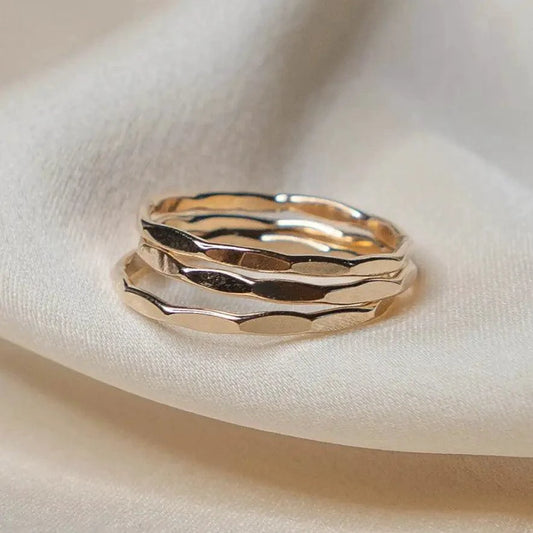 14K gold filled textured stacking ring by MANDOTOS, showcasing a hammered finish and delicate design for versatile jewelry styling.
