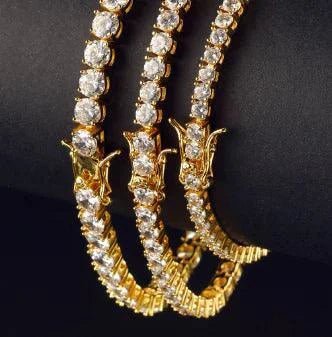 18K gold plated zircon tennis bracelet by MANDOTOS featuring sparkling zircon stones on a delicate chain.