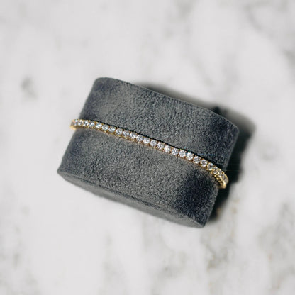 18K gold-plated zircon tennis bracelet by MANDOTOS featuring sparkling cubic zirconia stones on a delicate chain