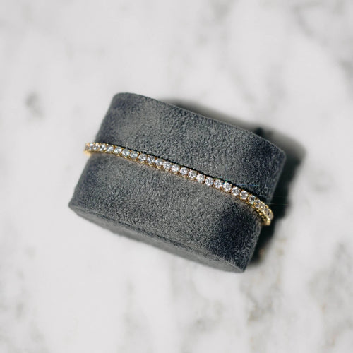 18K gold-plated zircon tennis bracelet by MANDOTOS featuring sparkling cubic zirconia stones on a delicate chain