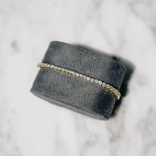 18K gold-plated zircon tennis bracelet by MANDOTOS featuring sparkling cubic zirconia stones on a delicate chain