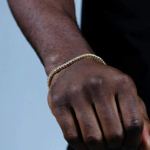 18K gold-plated zircon tennis bracelet by MANDOTOS featuring sparkling cubic zirconia stones and a sleek, elegant design.
