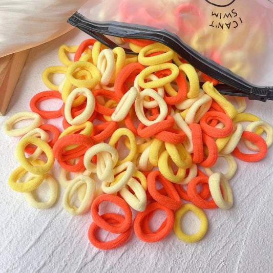 Set of 20/50 colorful kids elastic hair bands by Mandotos, featuring sweet scrunchie and rubber bands for children's hair accessories.
