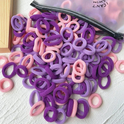 Set of 20/50 kids elastic hair bands with colorful sweets design by MANDOTOS, perfect for children's hair ties, clips, and headbands.