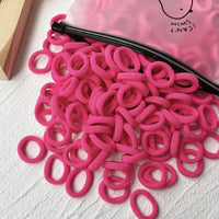 Set of 20/50 kids' elastic hair bands including scrunchies and hair ties, with colorful sweet-themed designs for children.