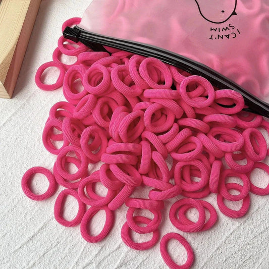 Set of 20/50 kids' elastic hair bands including scrunchies and hair ties, with colorful sweet-themed designs for children.