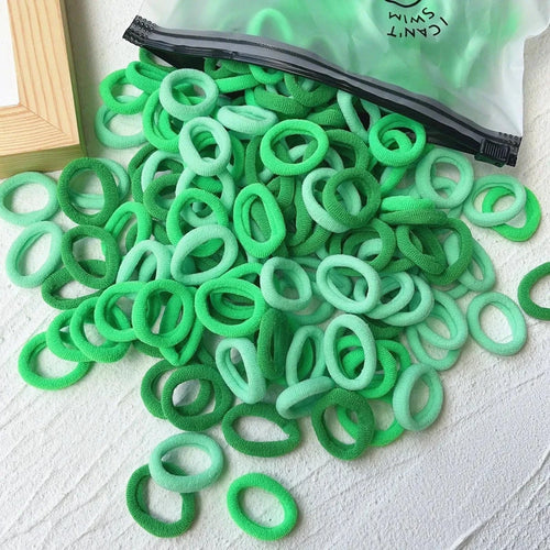 Set of 20/50 colorful kids' elastic hair bands by MANDOTOS, featuring sweet-themed scrunchies and hair ties for children and babies.