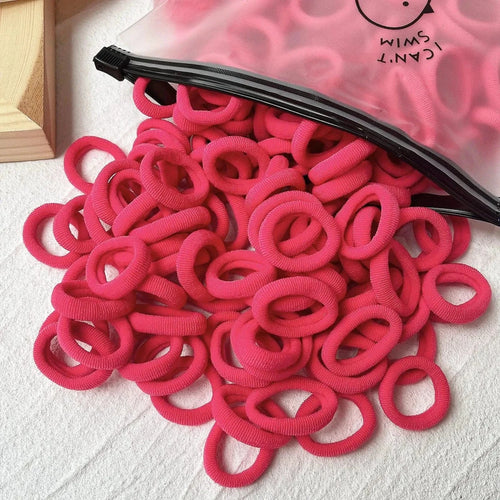 Set of 20/50 colorful kids elastic hair bands and scrunchies by MANDOTOS, suitable for children’s hair accessories and hair ties.