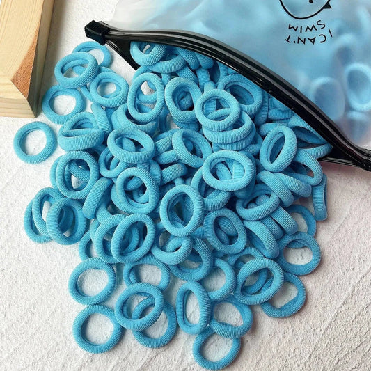 Set of 20/50 kids elastic hair bands by MANDOTOS, colorful sweets-themed scrunchies and hair ties for children and baby hair accessories.