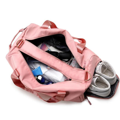 Mandotos waterproof fitness sports travel duffel bag with shoulder straps, ideal for gym, swim, and weekend trips for women and men.