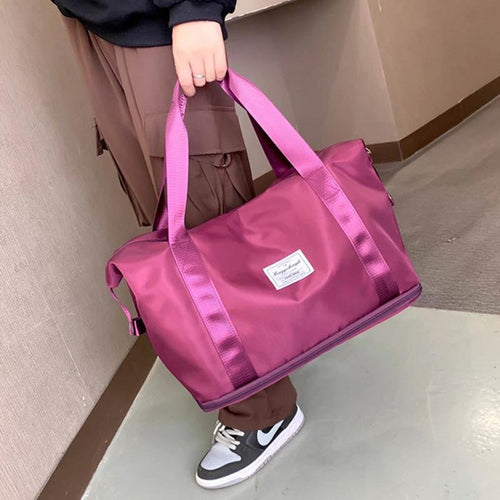 Mandotos large capacity travel gym shoulder bag with multiple compartments for workout, yoga, and outdoor activities.