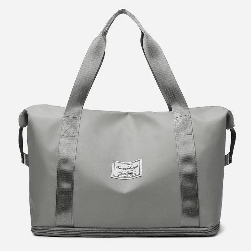 Mandotos large capacity travel bag for fitness, gym, workout, yoga, and outdoor activities with shoulder strap and spacious design.