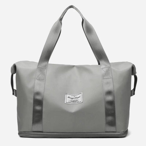 Mandotos large capacity travel bag for fitness, gym, workout, yoga, and outdoor activities with shoulder strap and spacious design.