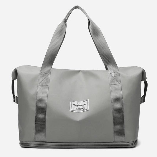 Mandotos large capacity travel bag for fitness, gym, workout, yoga, and outdoor activities with shoulder strap and spacious design.