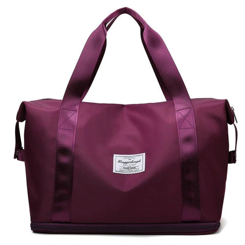 Mandotos large capacity travel bag for fitness, gym, workout, yoga, and outdoor activities with shoulder strap and multiple compartments.
