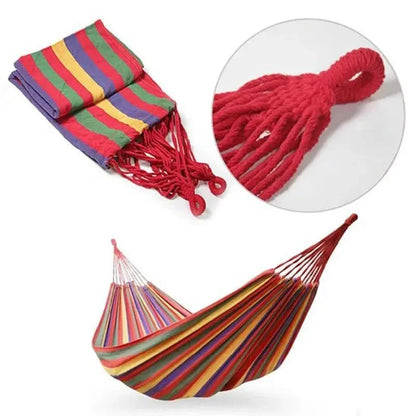 Mandotos Adventure Ready Hammock hanging between trees with a person relaxing outdoors in natural setting.
