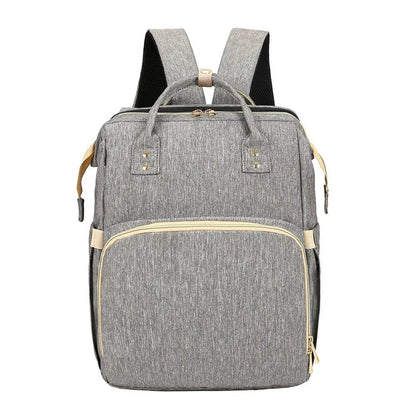 Mandotos all-in-one stroller diaper backpack with multiple compartments and adjustable straps for parents and babies.
