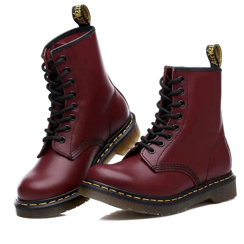 Mandotos all-season leather boots showing stylish ankle-high design with laces and durable leather material.