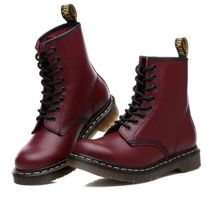 Mandotos all-season leather boots showing stylish ankle-high design with laces and durable leather material.