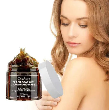 Mandotos Argan Rose Black Soap bar with natural ingredients, showcasing a dark, textured soap with rose and argan oil components.