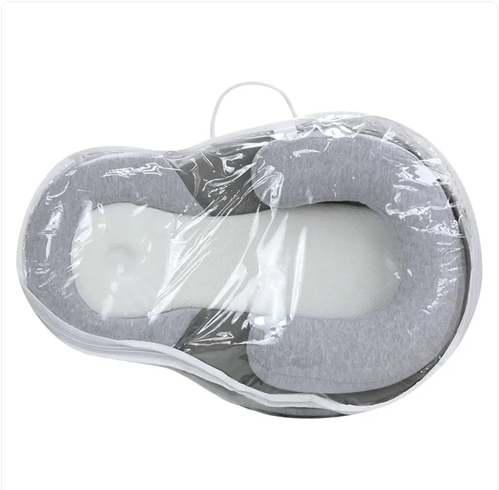 Baby Anti-Spit Up Pillow by MANDOTOS, soft and supportive pillow designed to reduce spit-up for infants.