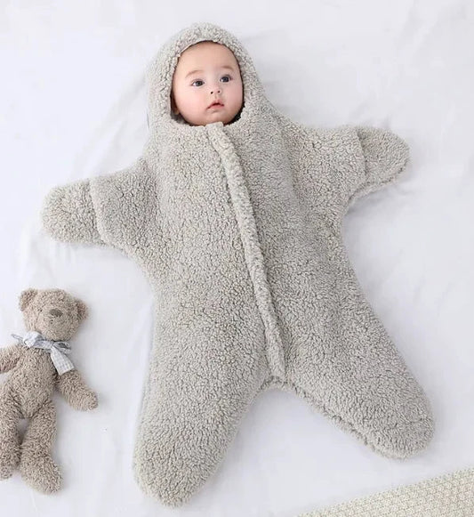 Soft baby quilt by MANDOTOS with colorful patterns, perfect for keeping infants cozy and comfortable.