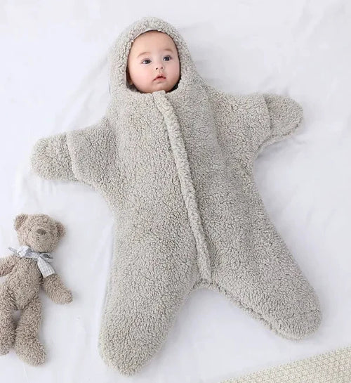 Soft baby quilt by MANDOTOS featuring colorful patterns, perfect for keeping infants warm and comfortable.