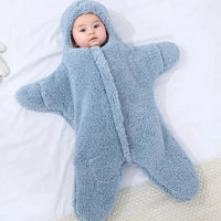 Soft baby quilt by MANDOTOS featuring colorful patterns, perfect for nursery and cuddling.