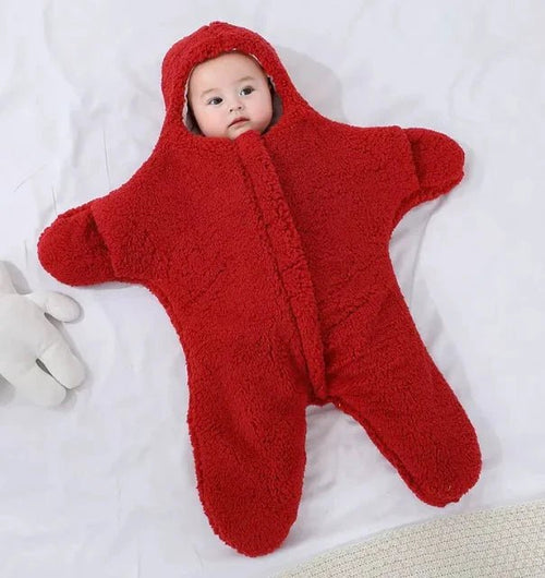 Soft baby quilt by MANDOTOS featuring colorful, cozy fabric with playful patterns for newborns and infants.
