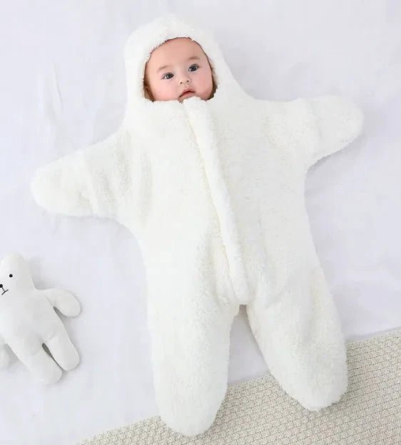 Soft baby quilt by MANDOTOS featuring colorful patterns and cozy fabric, perfect for nursery or stroller use.