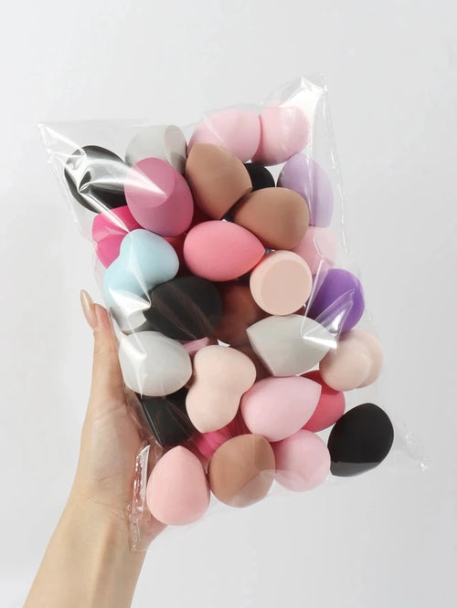 Set of 6 to 60 MANDOTOS beauty sponges and foundation mixing puffs, soft and versatile for flawless makeup application.