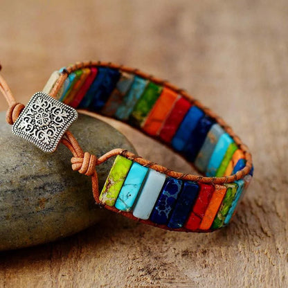 Mandotos boho chic leather bracelet featuring layered straps and metal accents, stylish and adjustable for a trendy look.
