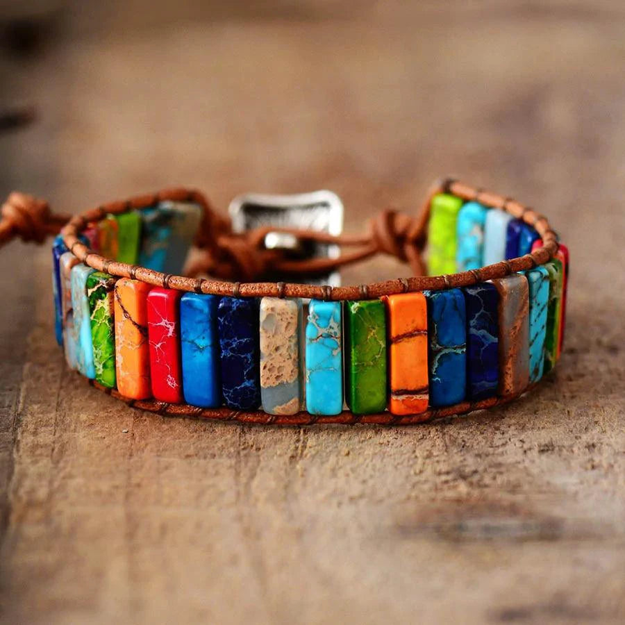 Mandotos Boho Chic leather bracelet with layered design and adjustable strap, featuring beads and metallic accents.