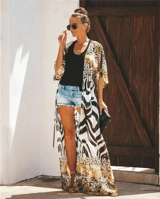 Mandotos Breeze Kimono Dress displayed on a hanger, featuring lightweight fabric, short sleeves, and a relaxed fit in a stylish design.