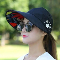Mandotos Breezy Pearl Visor Hat featuring a wide brim and pearl accents, perfect for sun protection and stylish outdoor wear.