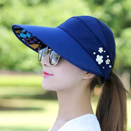 Mandotos Breezy Pearl Visor Hat featuring a wide brim and pearl accents for stylish sun protection.