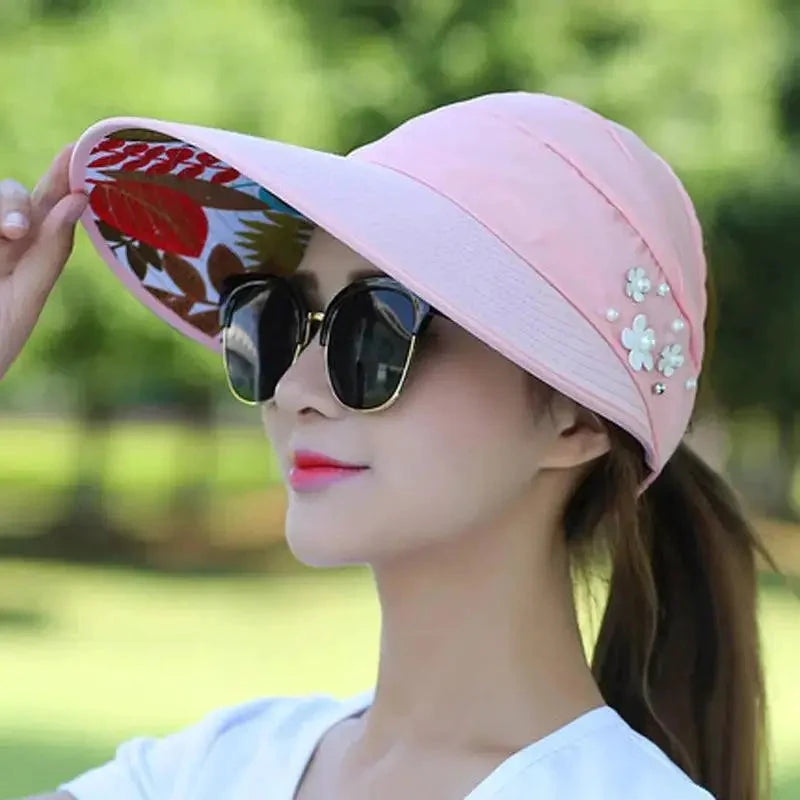 Mandotos Breezy Pearl Visor Hat with wide brim and pearl accents, perfect for sun protection and stylish outdoor wear.
