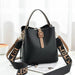 Mandotos Korean style bucket shoulder bag with crossbody strap, fashionable female bag made of durable material.