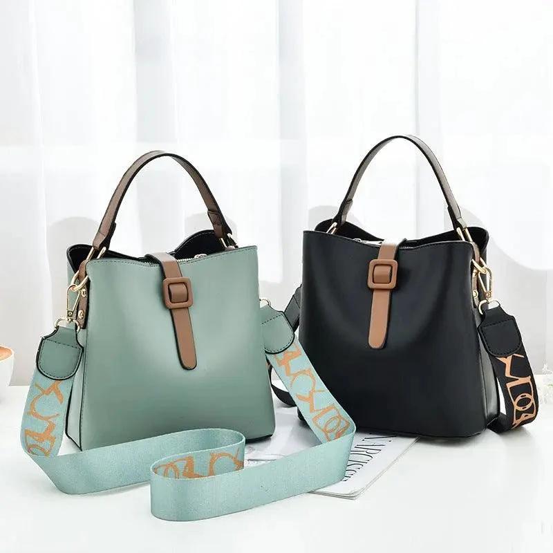 Mandotos Korean style bucket bag with shoulder strap, fashionable cross-border female handbag, black leather design.