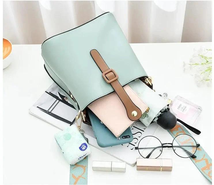 Mandotos Korean style bucket bag with shoulder strap, fashionable cross-border female bag in black leather.
