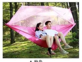 Mandotos Bug-Free Camp Hammock with mosquito protection, perfect for outdoor relaxation for two in a serene setting.
