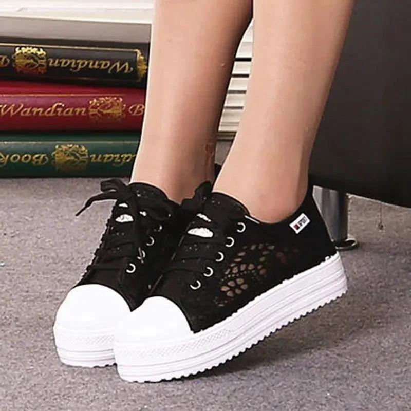 Mandotos women's canvas shoes featuring a casual, stylish design with white laces and a comfortable flat sole.